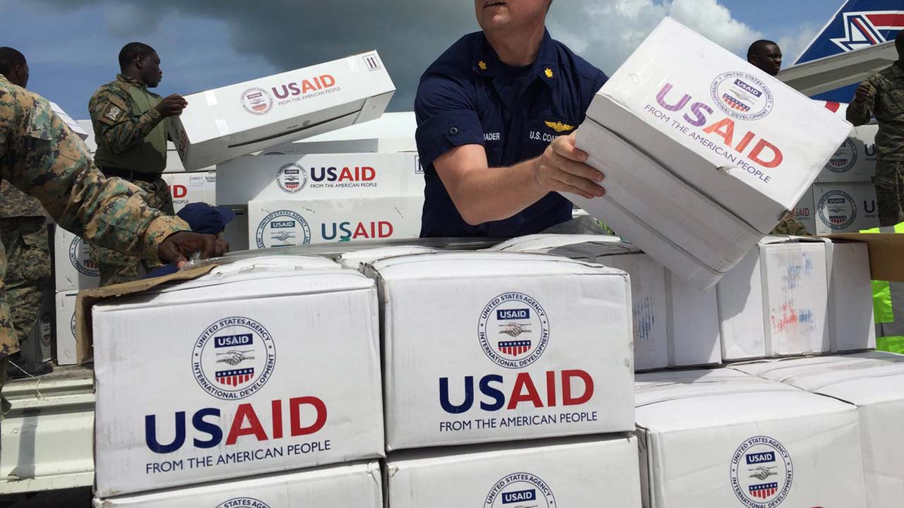USAID team giving out materials